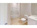 Bathroom features a tub with shower, white vanity, light flooring, and a toilet at 8122 Jacey Ln # 19, Huntersville, NC 28078