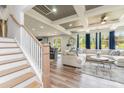 Elegant living room with coffered ceiling, hardwood floors, and ample natural light at 10045 Carousel Corral Dr, Midland, NC 28107