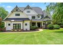 Charming two-story home with black trim, manicured landscaping and inviting curb appeal at 106 Kent Ct, Mooresville, NC 28117