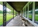 Comfortable front porch featuring decorative ironwork, stone floors, and ample space for relaxing at 111 Gordon Ave, Shelby, NC 28152