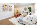Sunlit living room with modern decor, a comfortable sofa, and unique geometric wall art at 1152 Penrose Ln, Charlotte, NC 28217