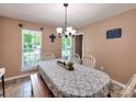 Cozy dining room featuring natural light, a chandelier, and seating for six at 121 Royalton Rd, Mooresville, NC 28115