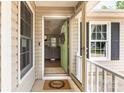 Inviting front entrance with open door and a welcoming wreath decor at 1626 Riverglenn Ct, Rock Hill, SC 29732