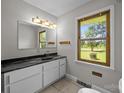 Bathroom featuring stylish vanity, granite countertops, and a large window at 1810 Country Manor Ln # 34, Rock Hill, SC 29730