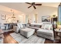 Spacious living room with a large sectional, ceiling fan, and dark wood floors at 18605 Ruffner Dr # 3E, Cornelius, NC 28031