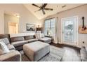 Inviting living room featuring a plush sectional sofa, stylish rug, and natural light at 18605 Ruffner Dr # 3E, Cornelius, NC 28031