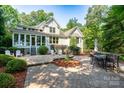 Spacious backyard patio perfect for entertaining, surrounded by lush greenery and serene views at 258 Patterson'S Bridge None, New London, NC 28127