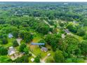 Scenic aerial shot of the home surrounded by mature trees in a tranquil neighborhood, address 2921 Ambrose Dr at 2921 Ambrose Dr, Gastonia, NC 28056