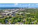 Expansive aerial view of a city skyline amidst lush greenery and vibrant urban development at 343 Melbourne Ct, Charlotte, NC 28209