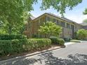 Two-story brick house features a side-entry garage and manicured hedges at 4026 Barclay Downs Dr, Charlotte, NC 28209