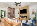 Inviting living room featuring a decorative wall, sleek fireplace, and comfortable seating arrangements at 411 Granby Cir, Charlotte, NC 28217