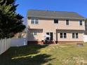 Spacious backyard featuring a patio area with outdoor seating, perfect for entertaining at 435 Riverwalk Nw Dv, Concord, NC 28027