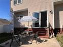 Outdoor patio with grill, umbrella, table, and chairs perfect for relaxing and entertaining at 435 Riverwalk Nw Dv, Concord, NC 28027