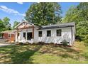 Charming single-story home featuring a brick facade, updated landscaping, and a inviting front porch at 4562 Rockford Ct, Charlotte, NC 28209