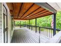 Spacious covered porch with wood ceiling and floor providing ample outdoor living at 51 Emily Ln, Taylorsville, NC 28681