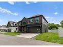 Beautiful house with a modern design, featuring clean lines and a well-kept lawn at 5432 Carmel Rd, Charlotte, NC 28210