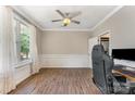 Bright and spacious office with hardwood floors, large window, and elegant trim work at 7642 Rolling Meadows Ln, Huntersville, NC 28078