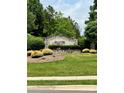 Stone sign for Arlington Hills community with lush landscaping at 9202 Arlington Hills Dr, Mint Hill, NC 28227