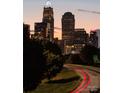 Charlotte skyline at dusk with vibrant lights and visible landmarks, creating a captivating view at 121 Verbena Ne St # 14, Charlotte, NC 28217