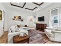 Comfortable living room with a coffered ceiling, and light wood flooring at 139 Batten Ridge Dr, Statesville, NC 28677