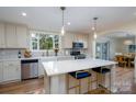 Bright kitchen with island, stainless appliances, and modern finishes exudes style at 16132 Mclester Rd, Oakboro, NC 28129