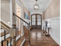 Elegant foyer features hardwood floors, wainscoting, and stylish lighting fixtures at 1622 Hunters Place Rd, York, SC 29745