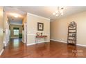Spacious living area featuring hardwood floors and neutral paint at 1905 Yellow Daisy Dr, Matthews, NC 28104