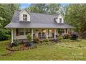 Charming home with a welcoming front porch and beautifully landscaped front yard at 223 Tennessee Trl, Lincolnton, NC 28092