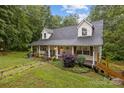 Charming home with a welcoming front porch and beautifully landscaped front yard at 223 Tennessee Trl, Lincolnton, NC 28092