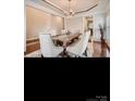 Elegant dining room featuring hardwood floors, statement lighting, and a modern dining set at 2234 Donnington Nw Ln, Concord, NC 28027