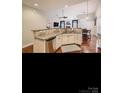 Modern kitchen with stainless steel appliances, granite countertops, and ample cabinet space at 2234 Donnington Nw Ln, Concord, NC 28027