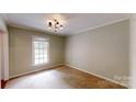 Cozy bedroom featuring a window that provides plenty of natural light and neutral walls at 2507 Birnen Dr, Charlotte, NC 28210