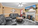 Inviting living room featuring a fireplace, comfortable seating, and a warm ambiance at 2809 Waycross Dr, Monroe, NC 28110
