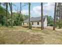 The back of this home features a freshly built wooden deck at 403 W Charlotte Ave, Mount Holly, NC 28120