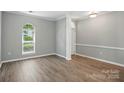 Light and airy dining room with gray walls and wide plank floors at 4612 Saxonbury Way, Charlotte, NC 28269