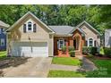 Charming home featuring a two-car garage and manicured landscaping at 4612 Saxonbury Way, Charlotte, NC 28269