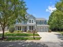 Beautiful two-story home showcasing manicured landscaping and a spacious driveway leading to the attached two-car garage at 5005 Hedgebrook Ln, Waxhaw, NC 28173