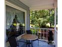 Relaxing covered porch with seating, offering a serene outdoor space to enjoy the surrounding greenery at 517 Powell St, Rock Hill, SC 29732