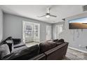 Living room with a large window, gray walls, and stylish flooring at 719 Dawn Cir, Charlotte, NC 28213
