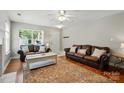Spacious living room featuring hardwood floors, comfortable seating, and natural lighting at 820 Settlement St, Clover, SC 29710
