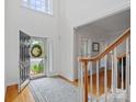 Bright, open foyer with hardwood floors and staircase, leading to the rest of the home at 11917 Ulsten Ln, Huntersville, NC 28078