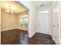 Dining room features hardwood floors, a chandelier, and lots of natural light at 1329 Jacemans Way, Cornelius, NC 28031