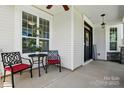 Cozy front porch with seating area and decorative wreath, creating an inviting entrance to the home at 1478 Imperial Ct, York, SC 29745