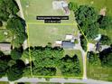 Expansive aerial view showcasing the home's placement on a generous 1.5-acre lot surrounded by mature trees at 1585 Salem Church Rd, Lincolnton, NC 28092