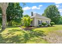 Picturesque home with a well-maintained lawn, mature trees, and a inviting front porch at 233 Sellars Rd, Kings Mountain, NC 28086