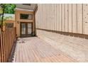 A spacious, wooden back porch offers a private retreat for outdoor relaxation and entertaining at 4025 Ivystone Ct, Charlotte, NC 28277