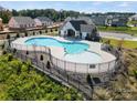 Community pool with a bath house and surrounding neighborhood homes at 4122 Vista Pine Dr, Charlotte, NC 28215