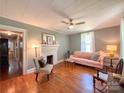 Inviting living room featuring hardwood floors, a fireplace, and ample natural light at 436 8Th Avenue Nw Dr, Hickory, NC 28601