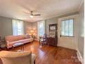 Cozy living room with hardwood floors, bright windows, and comfortable seating at 436 8Th Avenue Nw Dr, Hickory, NC 28601