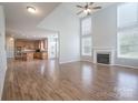 Spacious living room boasts a fireplace, high ceilings, and an open-concept design leading to the kitchen at 4392 Sunset Rose Dr, Fort Mill, SC 29708
